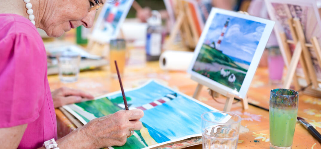 How to book “Group painting session around a sunny table.”